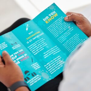 Covid,,Brochure,And,Person,Reading,Information,On,A,Virus,For